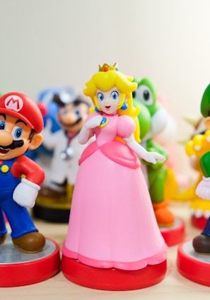 Mario, Luigi, and Princess Peach figurines