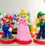 Mario, Luigi, and Princess Peach figurines