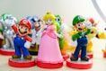 Super Mario, Luigi, and Princess Peach figurines