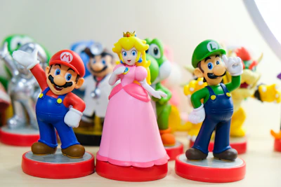 Super Mario, Luigi, and Princess Peach figurines