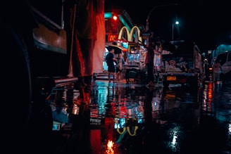 people near road and cars