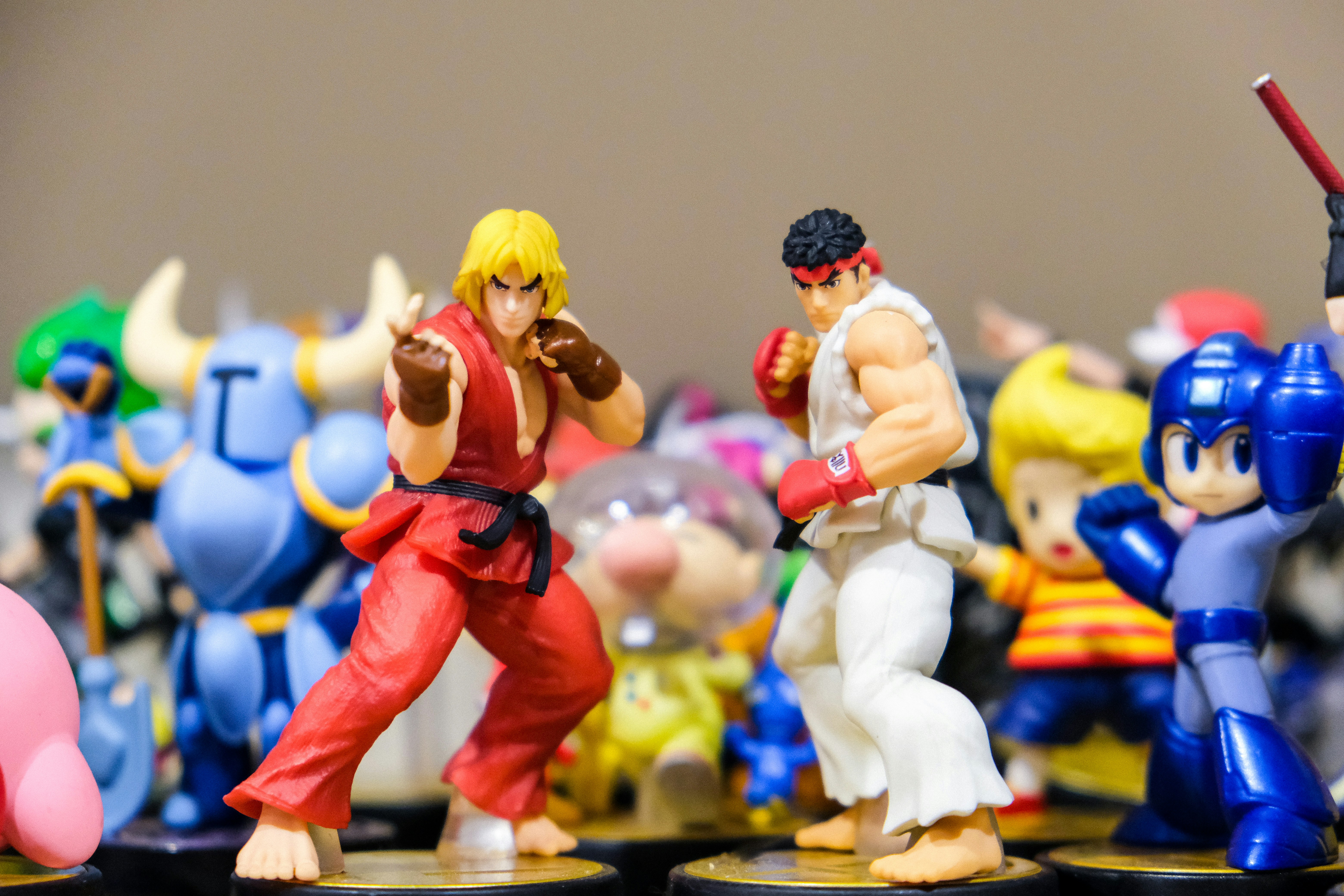Nintendo amiibo toys of the characters Ryu and Ken from Capcom's Street Fighter, Megaman, Olimar from Pikmin, Ness from Earthbound, and Shovel Knight.