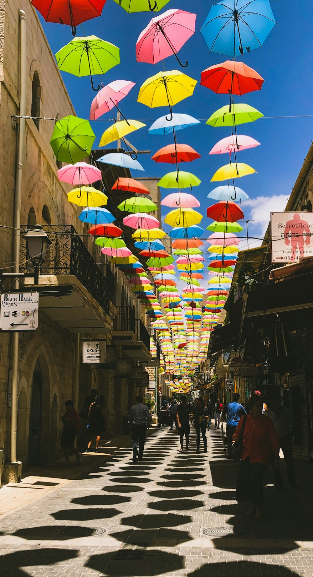 people walking underneath umbrellas