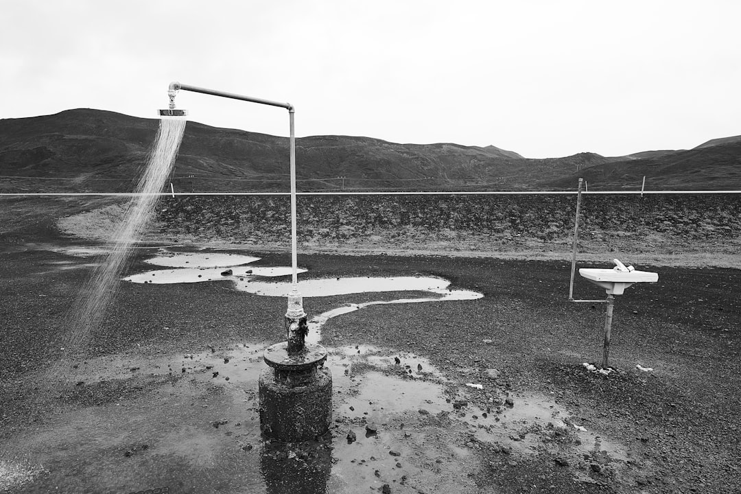 grayscale photography of shower head