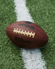 Close-up of a football player with a sleek branded logo overlay.