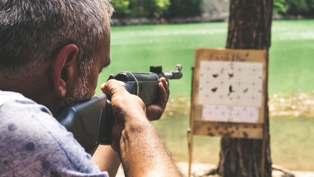 man holding rifle