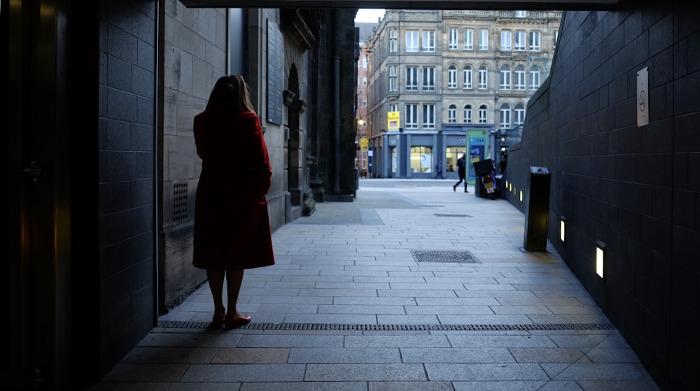 woman standing on sidewalk