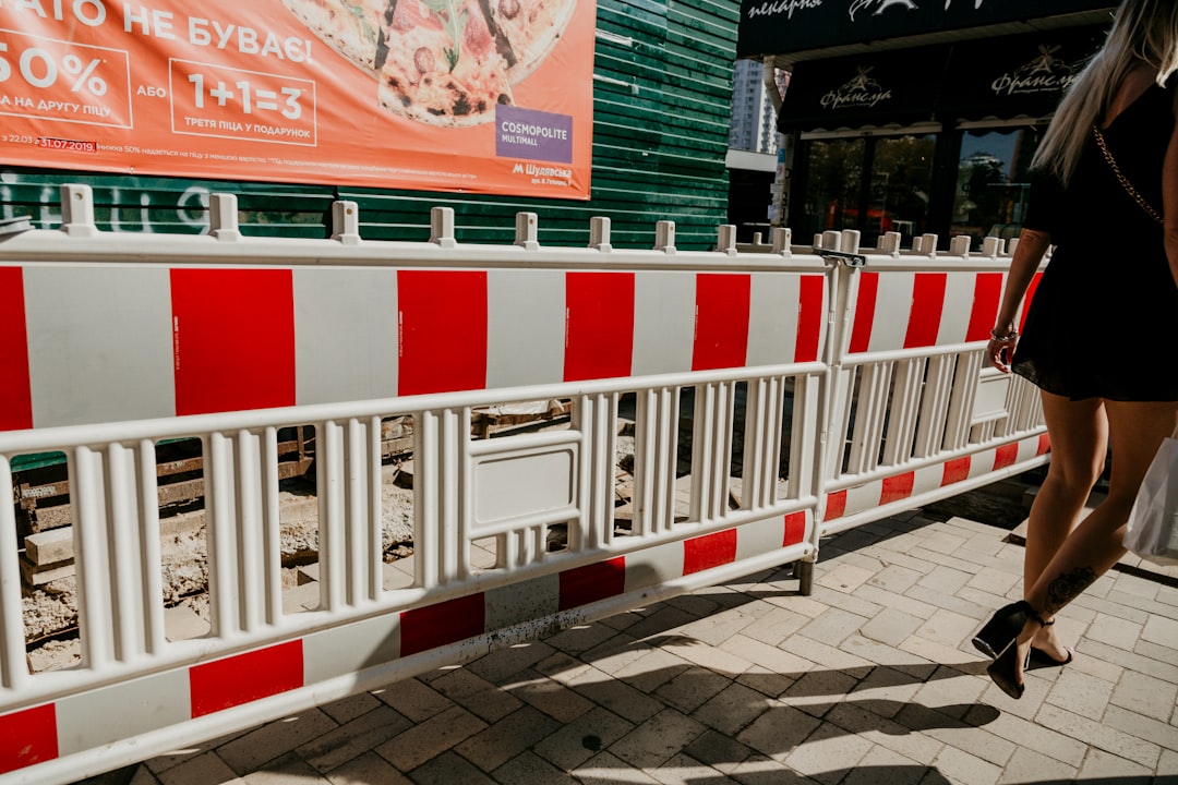 red and white metal fence