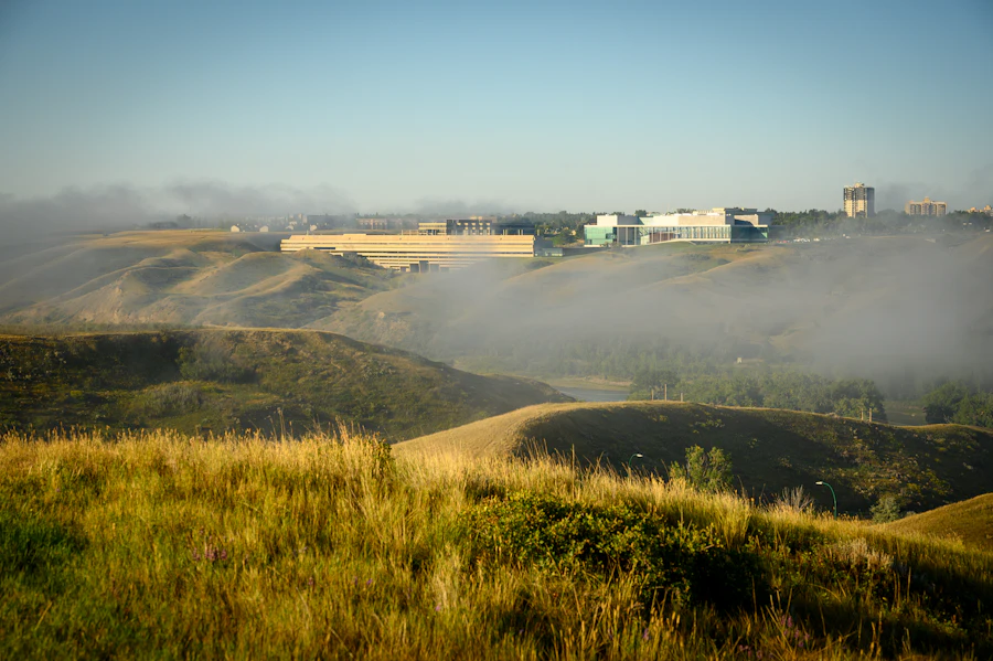 University of Lethbridge seen across the Oldman River valley in morning fog