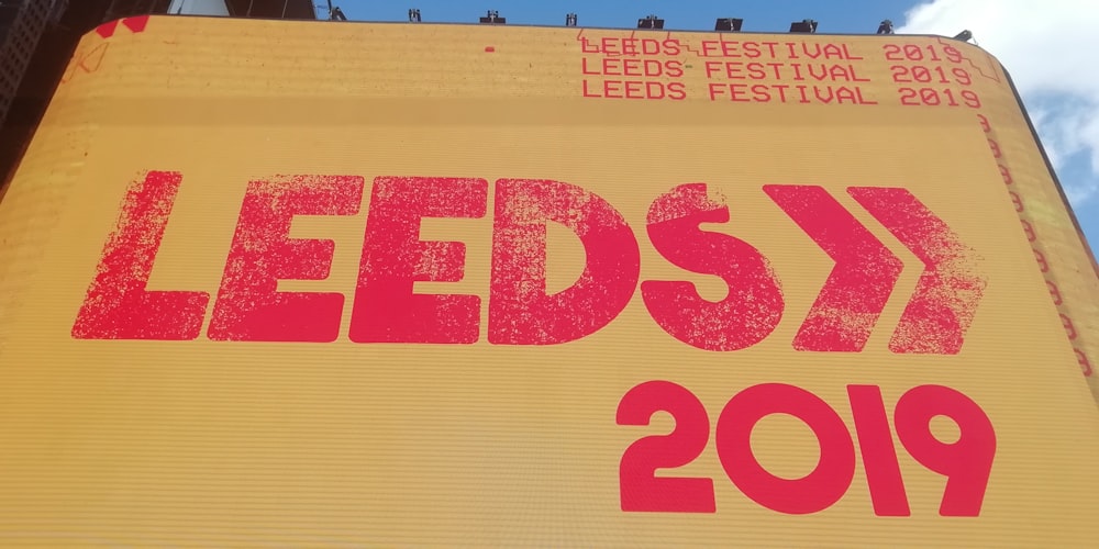 a sign that says leedsx on the side of a building