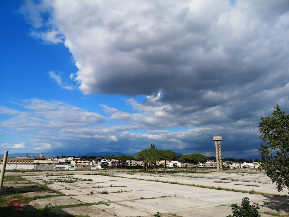 building lot under white clouds during daytime
