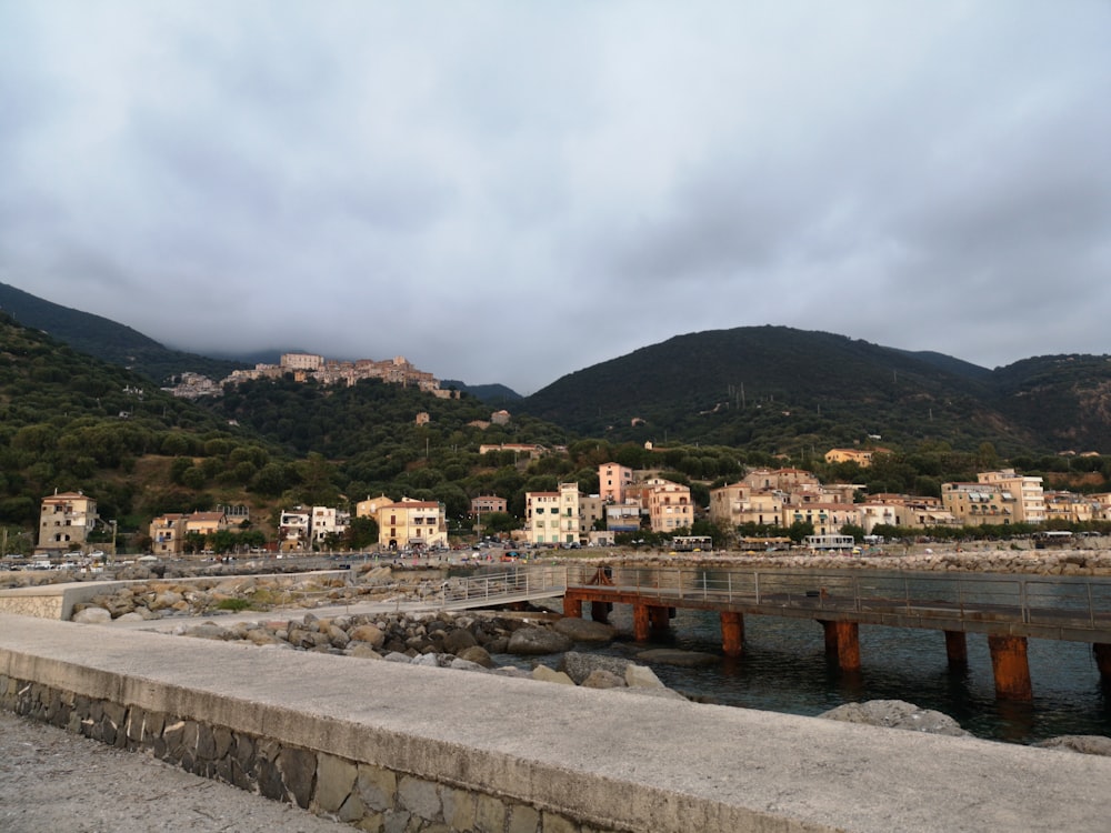 a view of a town and a body of water