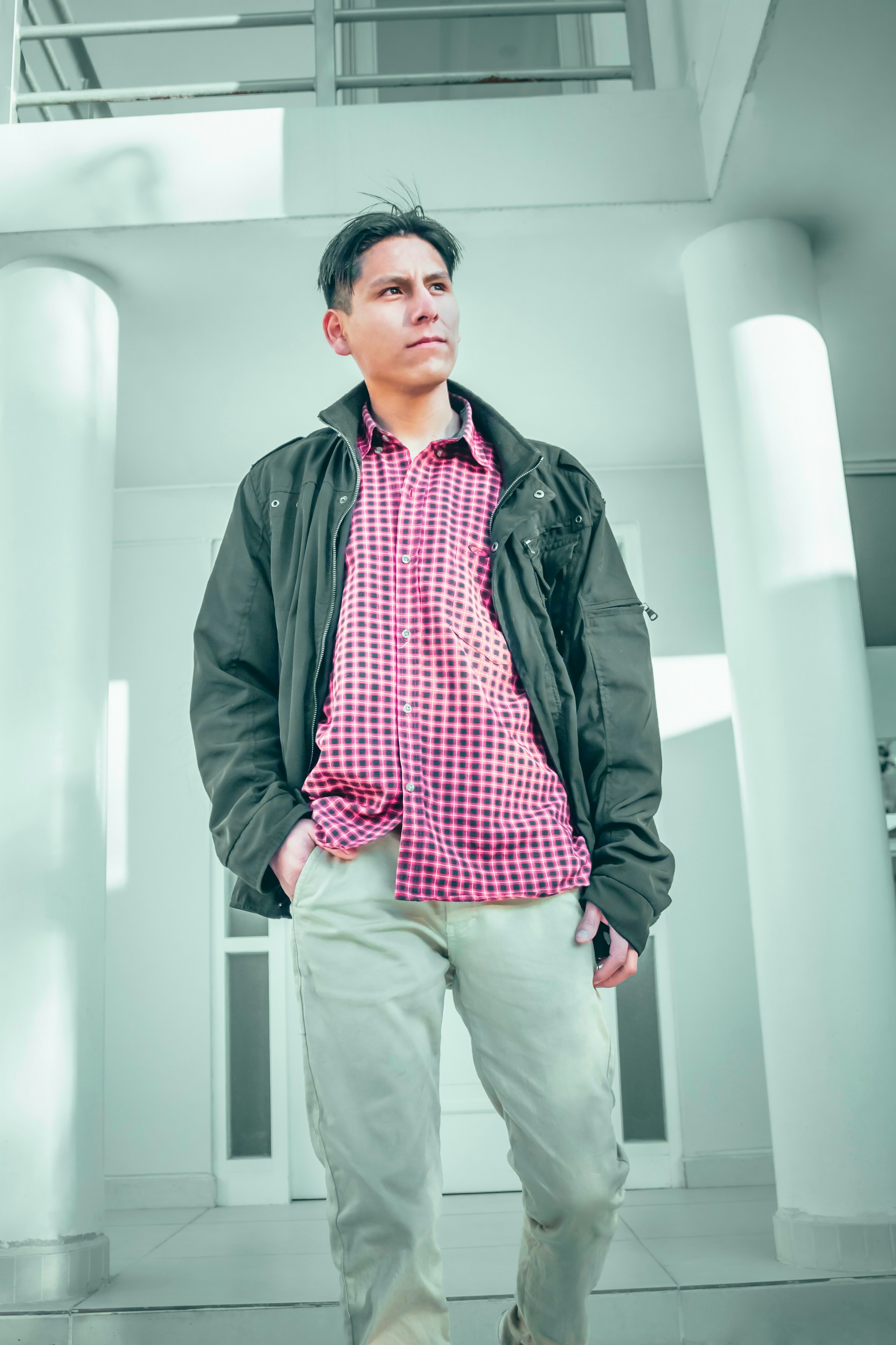 A young Asian professional in smart casual attire, standing confidently with a backdrop blending Taiwanese and Mexican cultural elements.