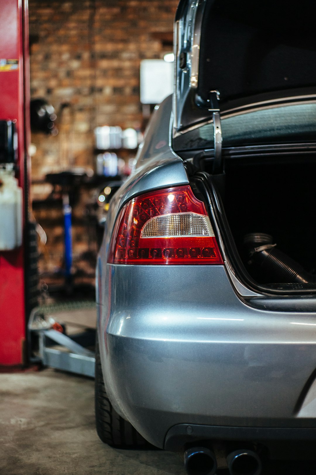 silver car with open trunk