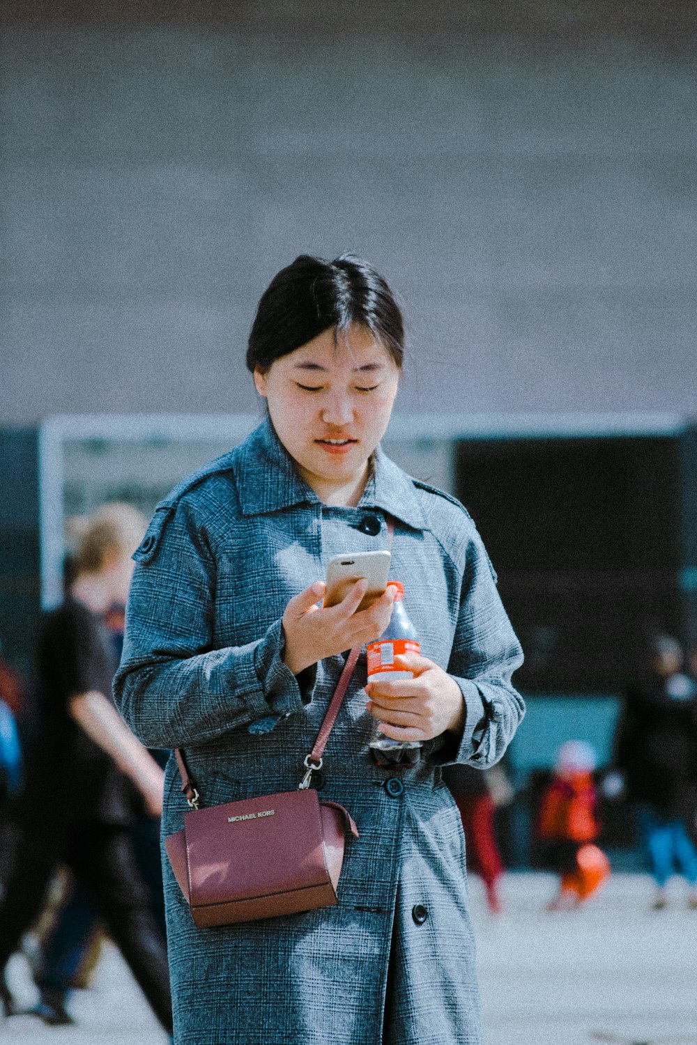 women holding a phone during daytime