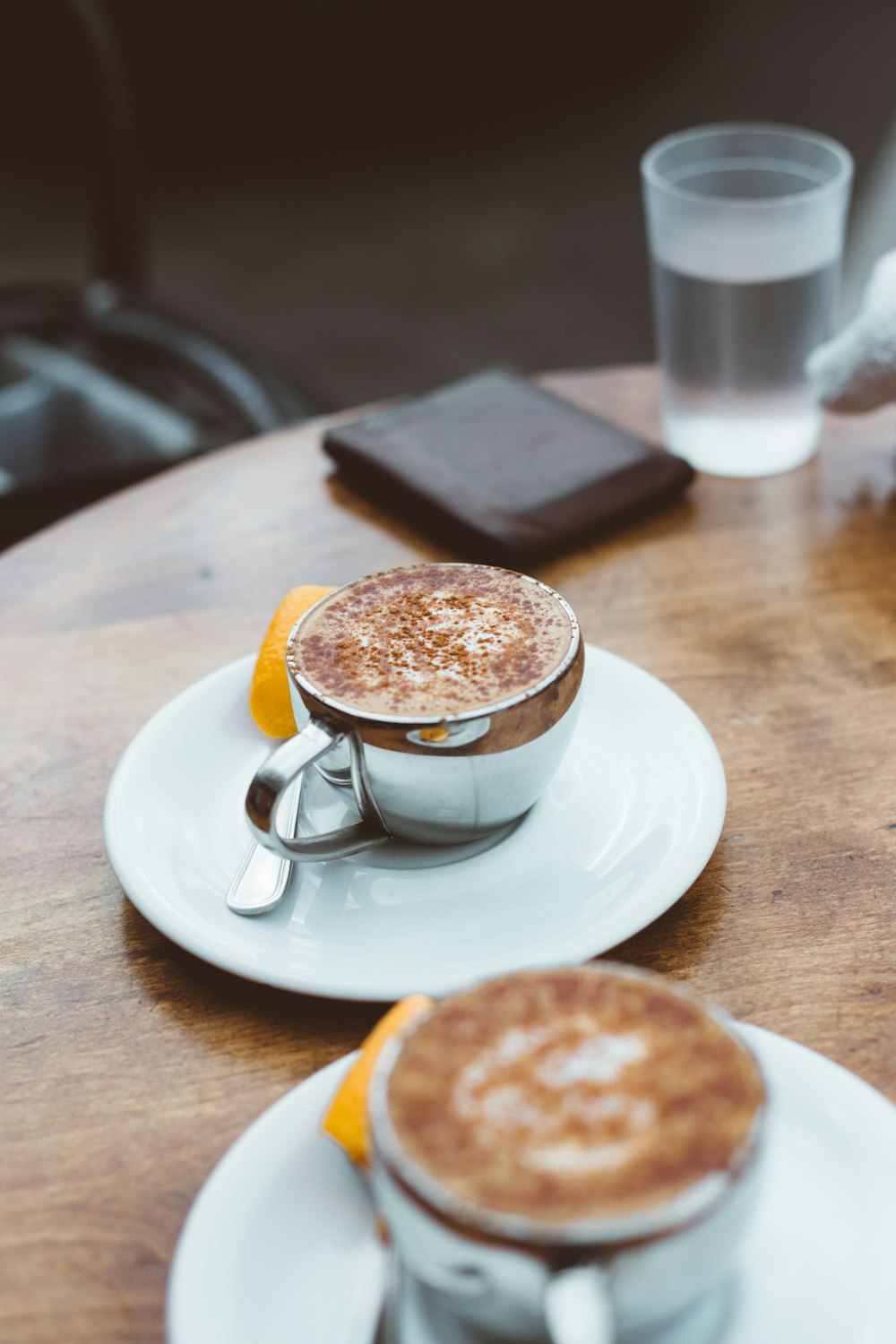 a couple of cups of coffee sitting on top of a table