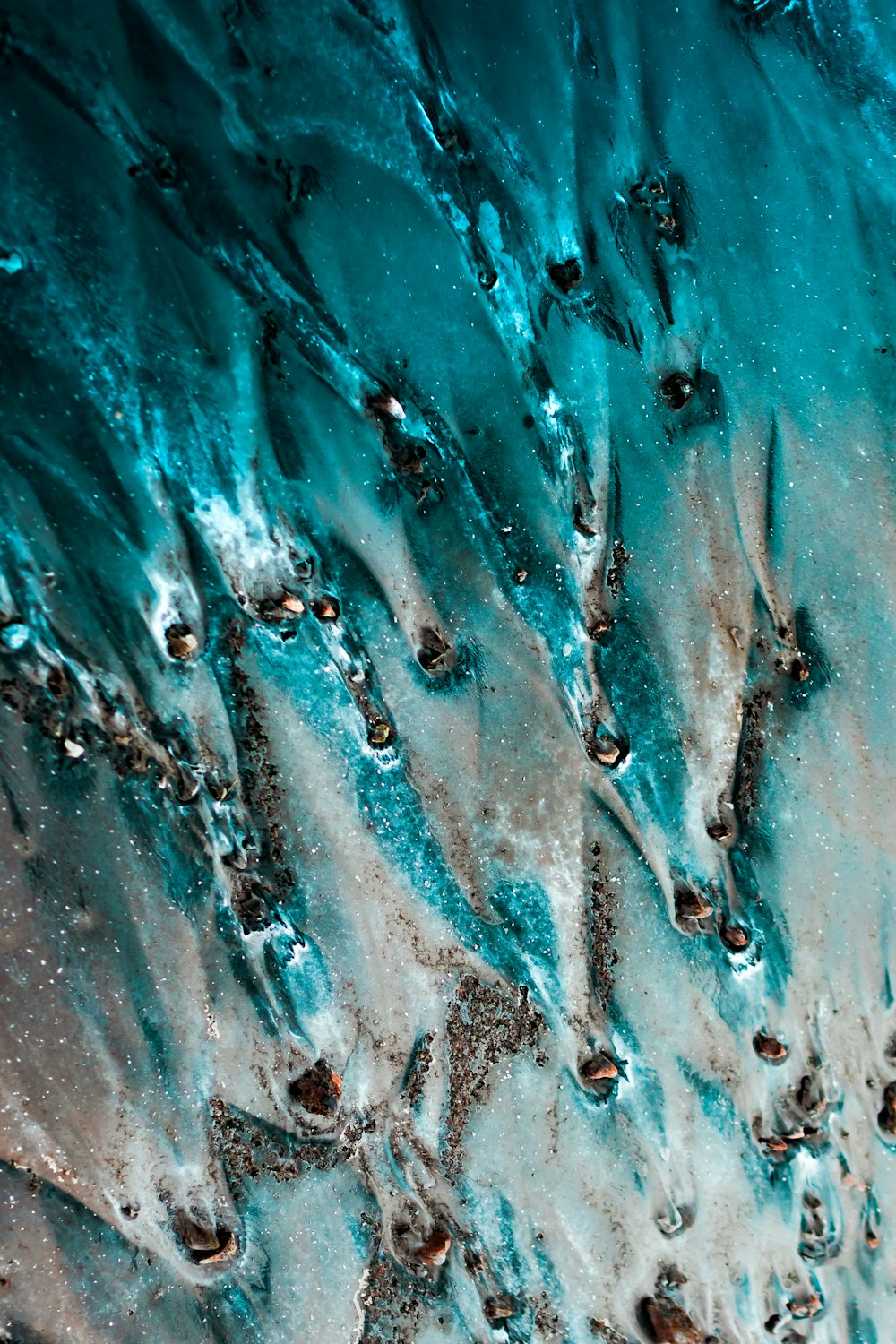 a close up view of water and sand