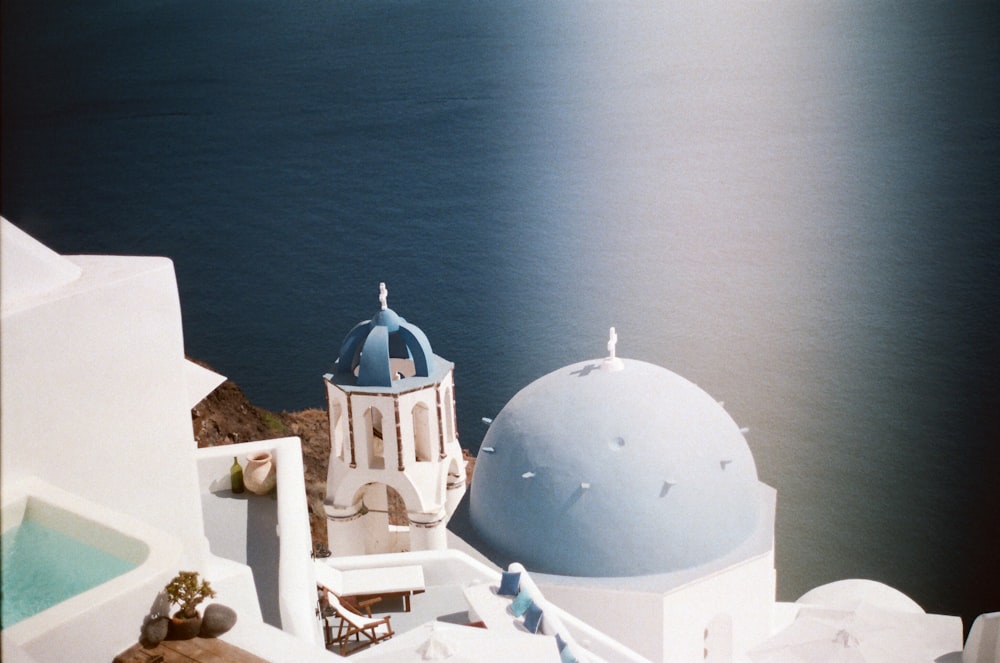 white and blue concrete houses close-up photography