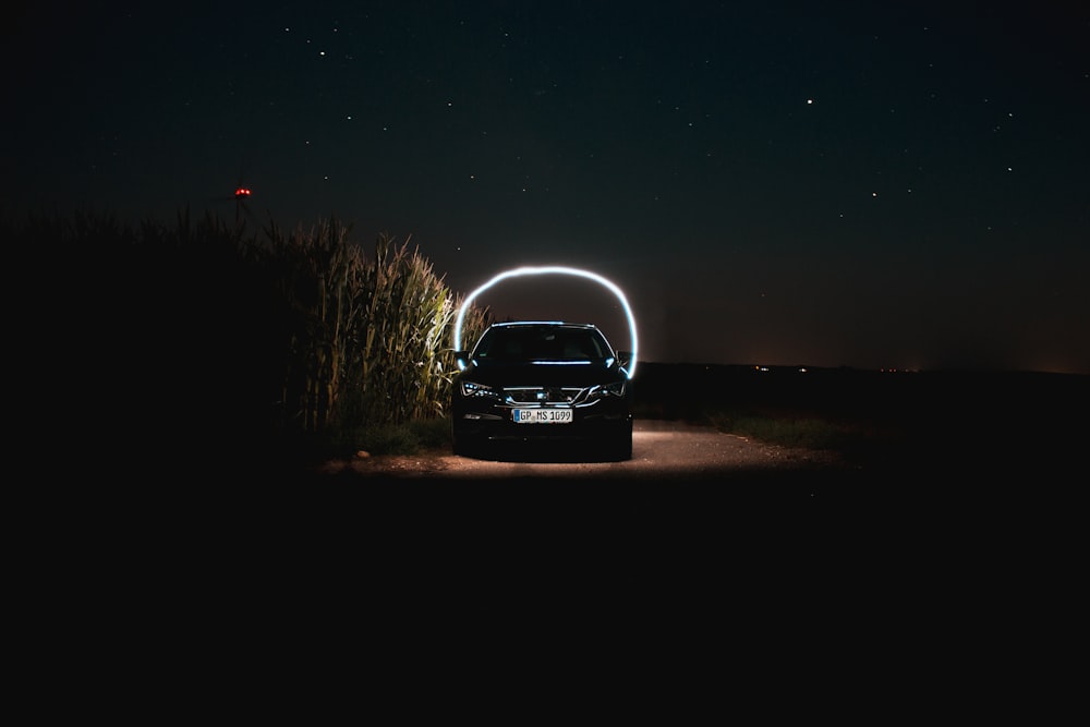 black sedan inside road tunnel