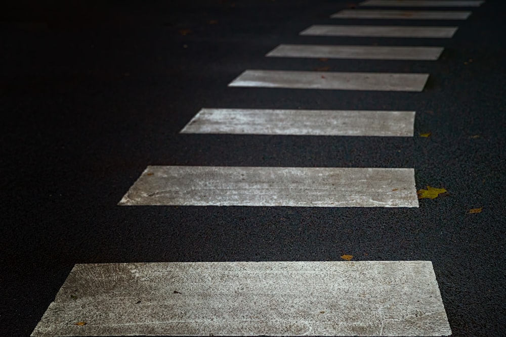 a black and white photo of a cross walk