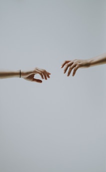 two hands about to hold wallpaper
