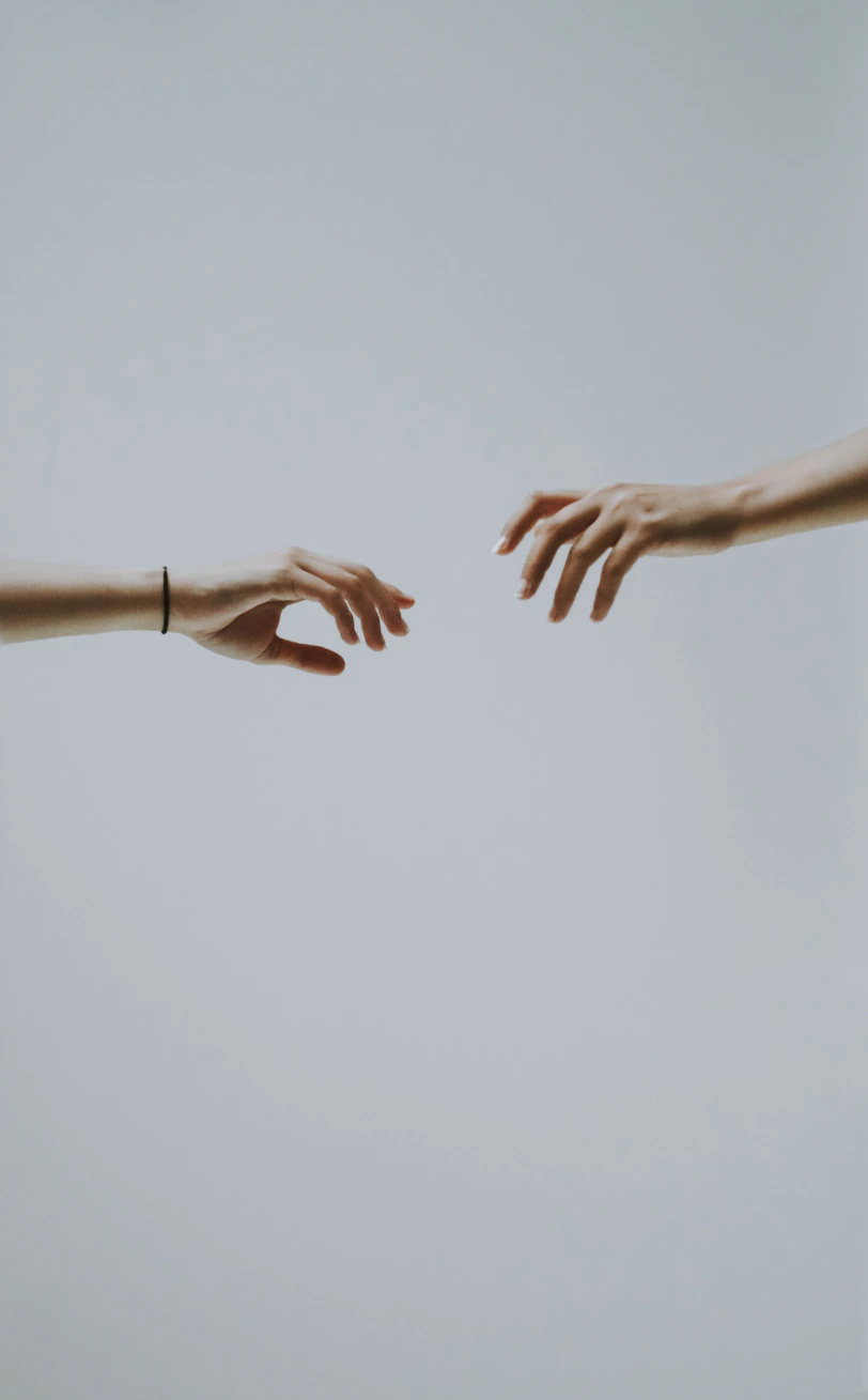 two hands about to hold wallpaper