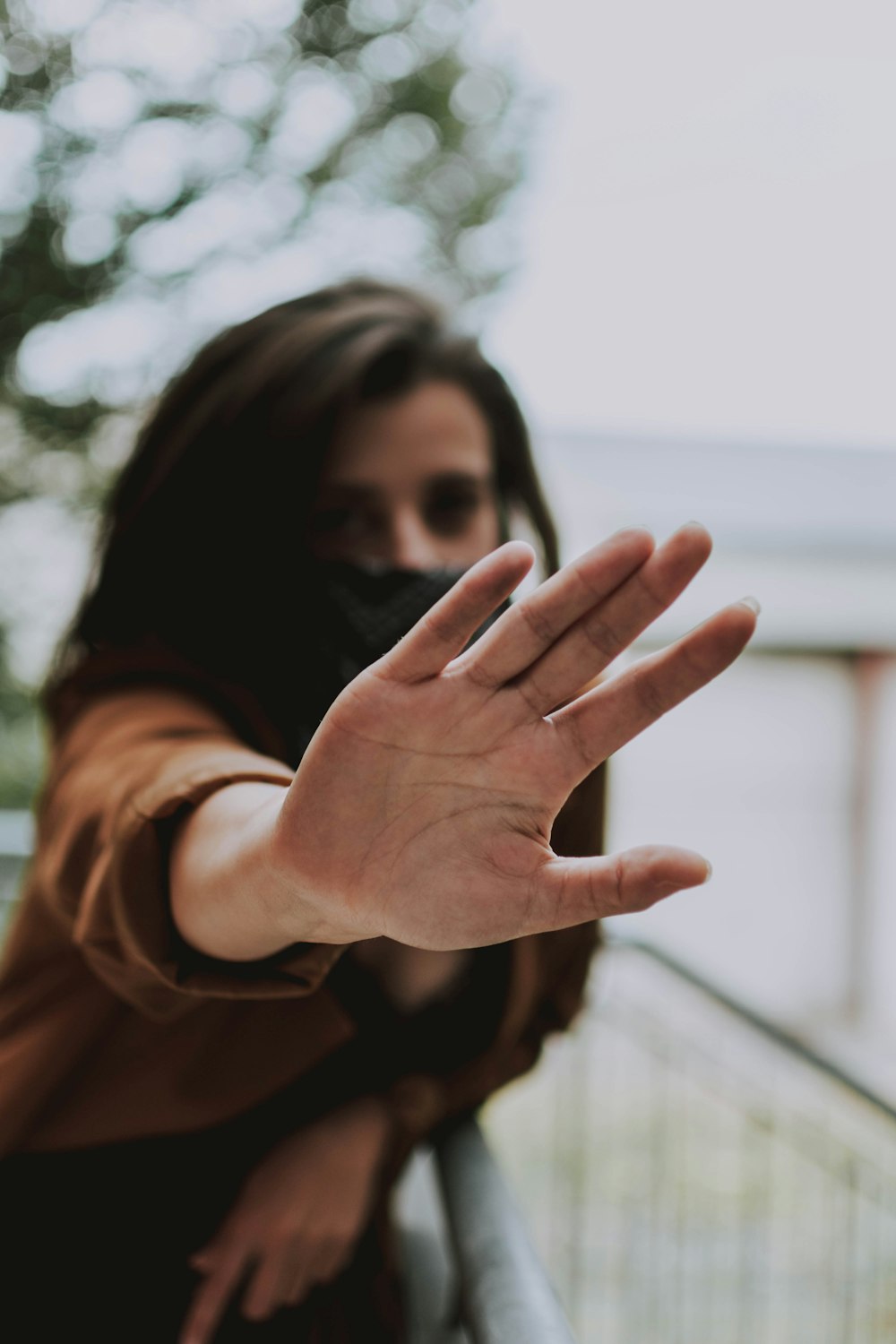 woman standing and showing right hand