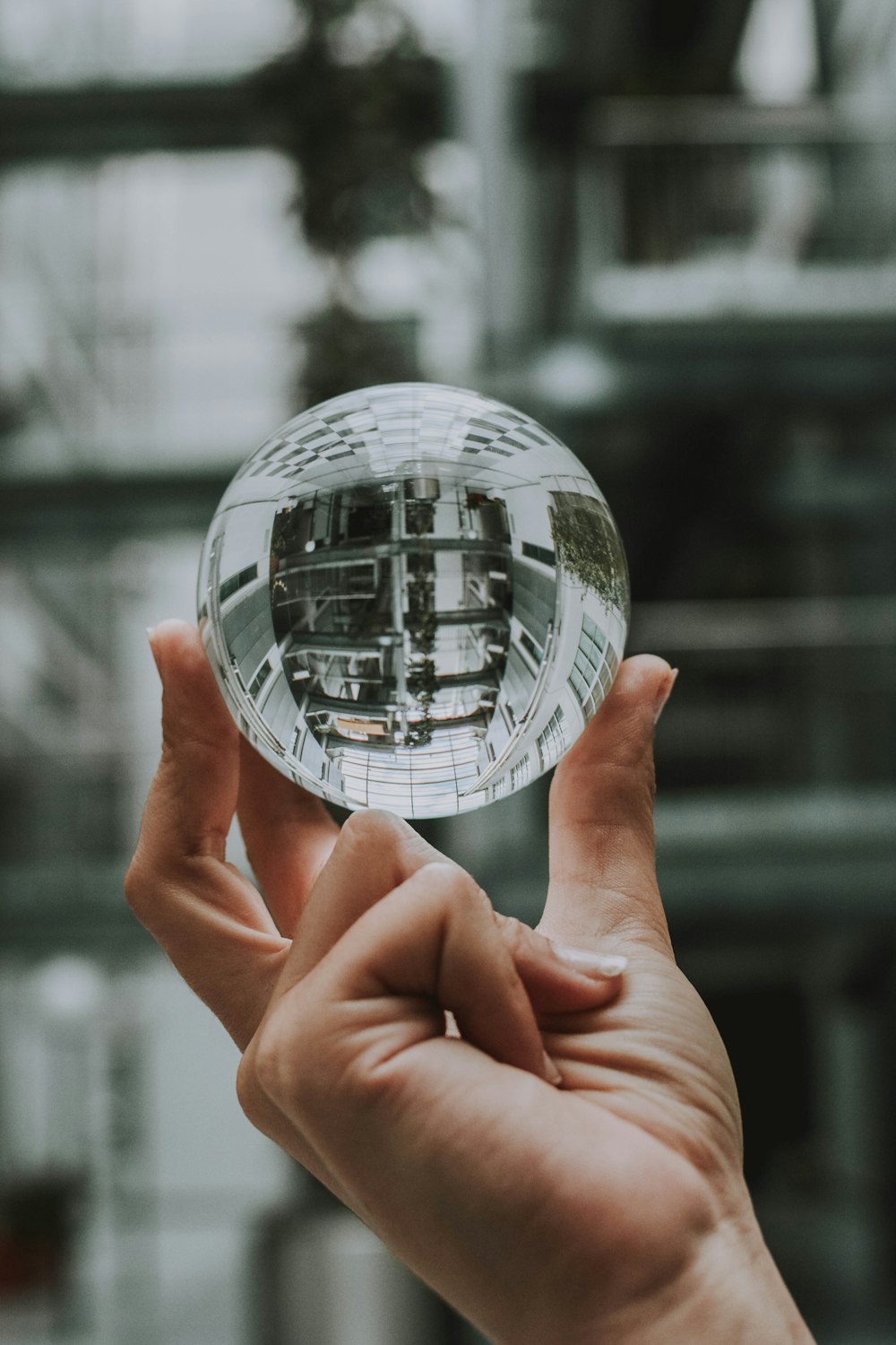 person holding clear gemstone