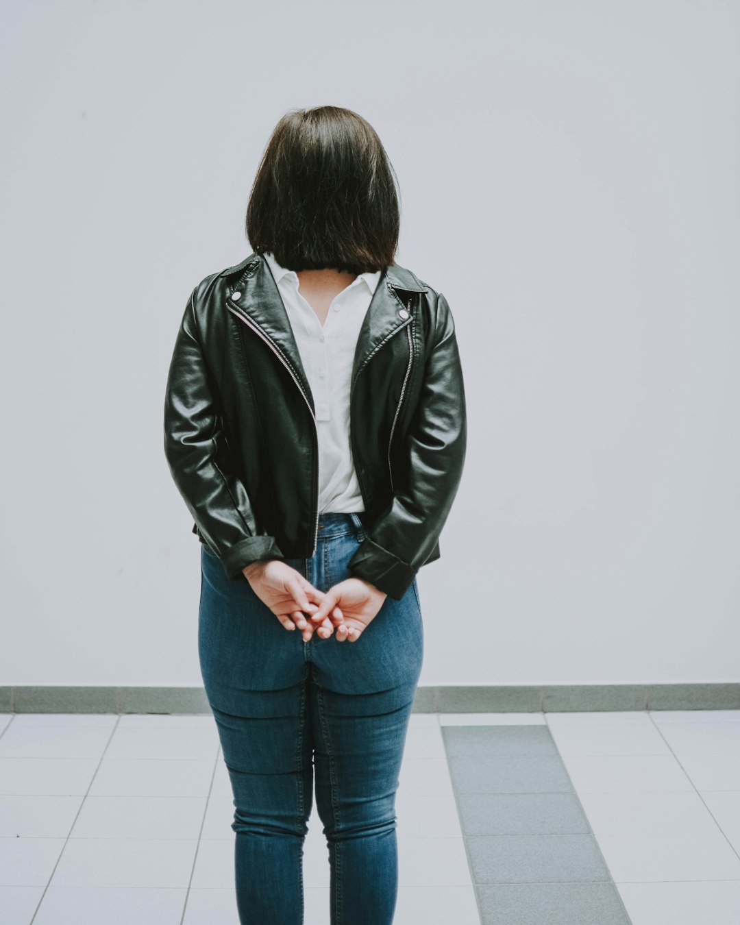 woman wearing black leather zip-up jacket