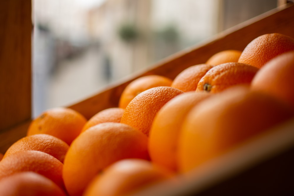 orange fruits in container