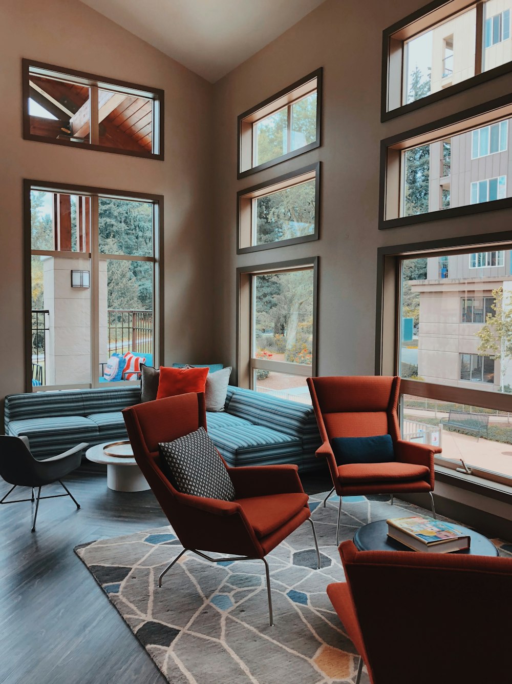 two orange sofa chairs inside room