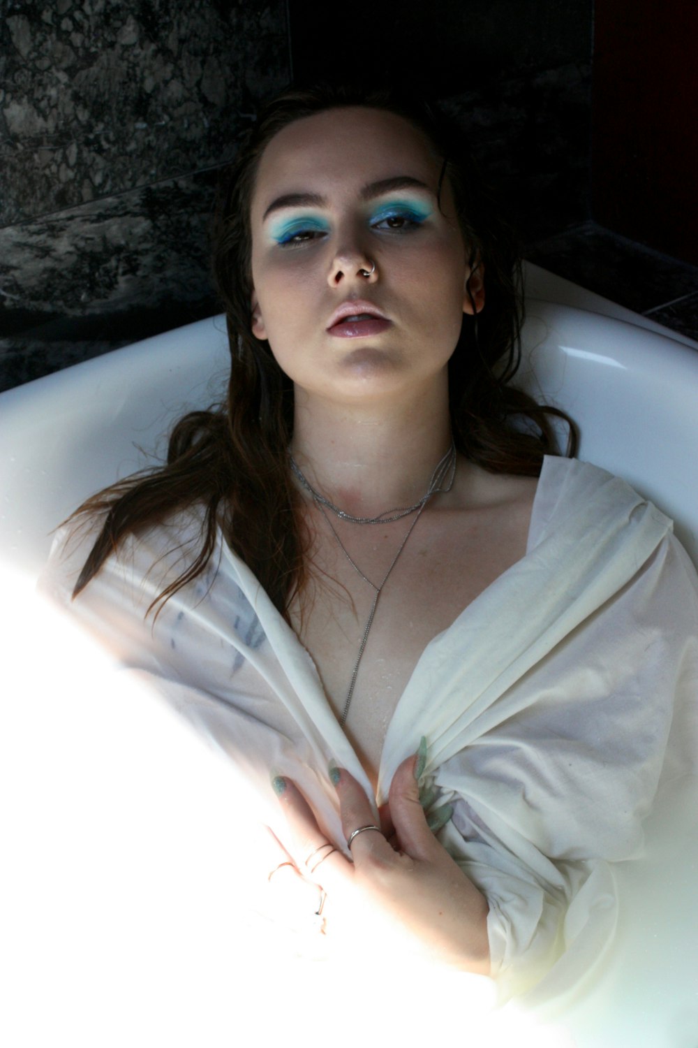 woman in bathtub close-up photography