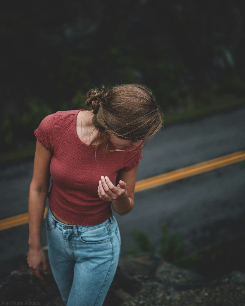 woman wearing red crew-neck cap-sleeved shirt outdoor during daytime