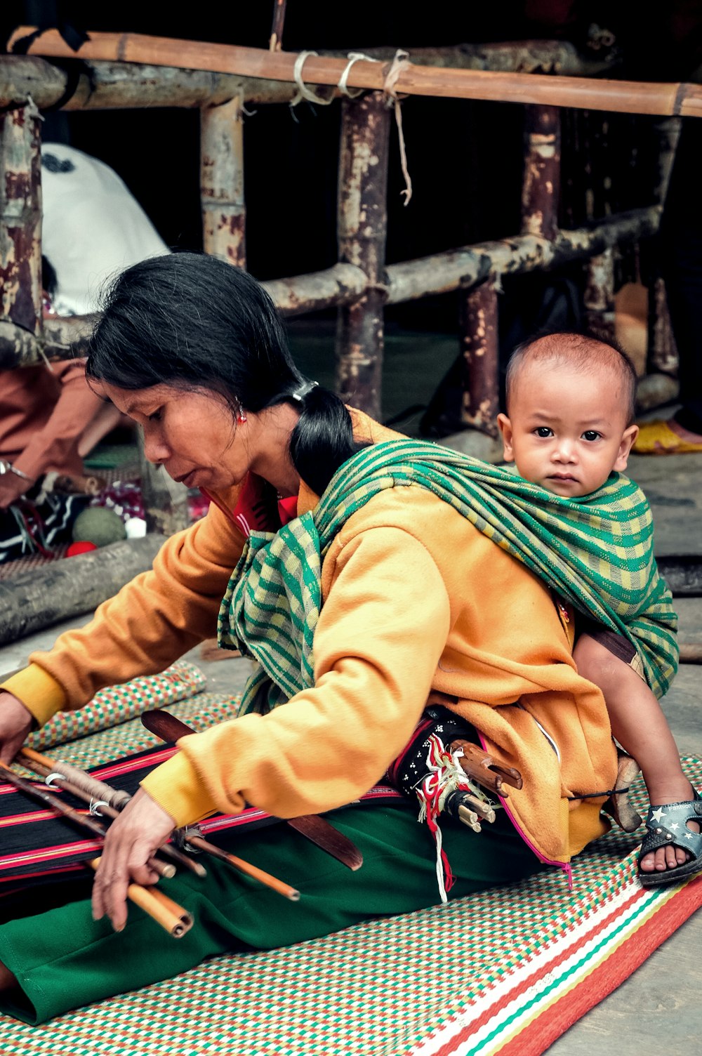 woman carrying baby on her back