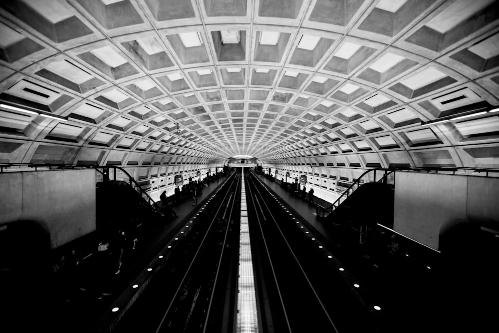 a black and white photo of a train station