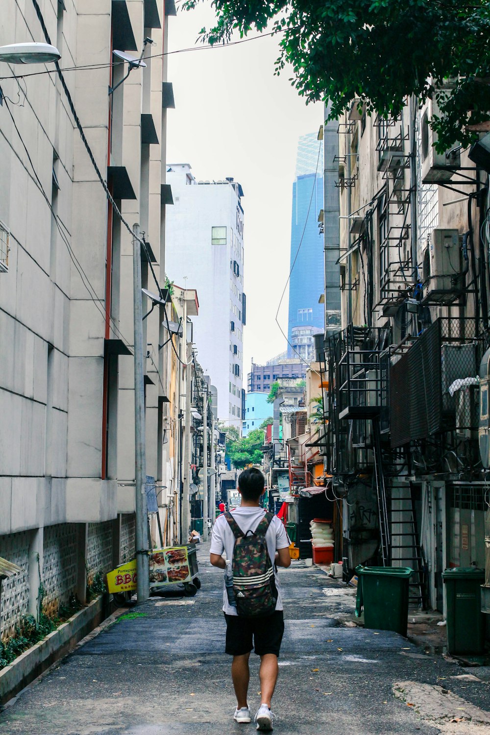 man walking on road