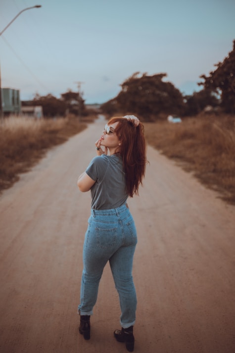 woman standing on road