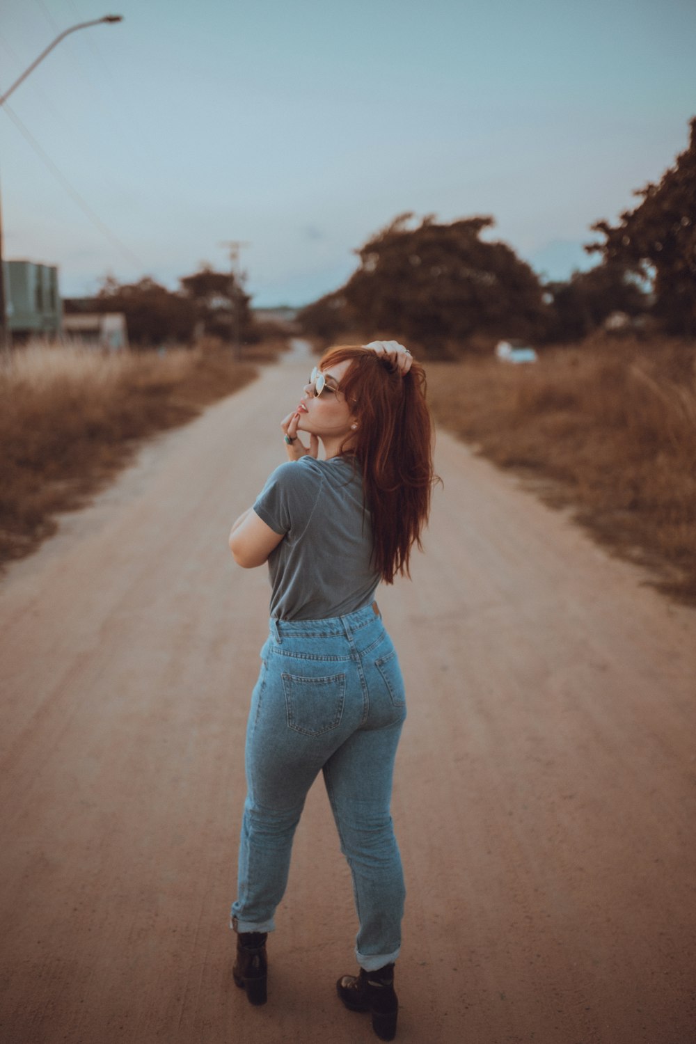 woman standing on road