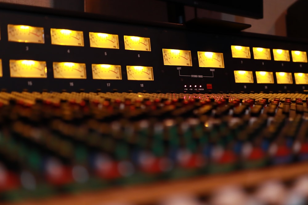 a close up of a sound mixing console