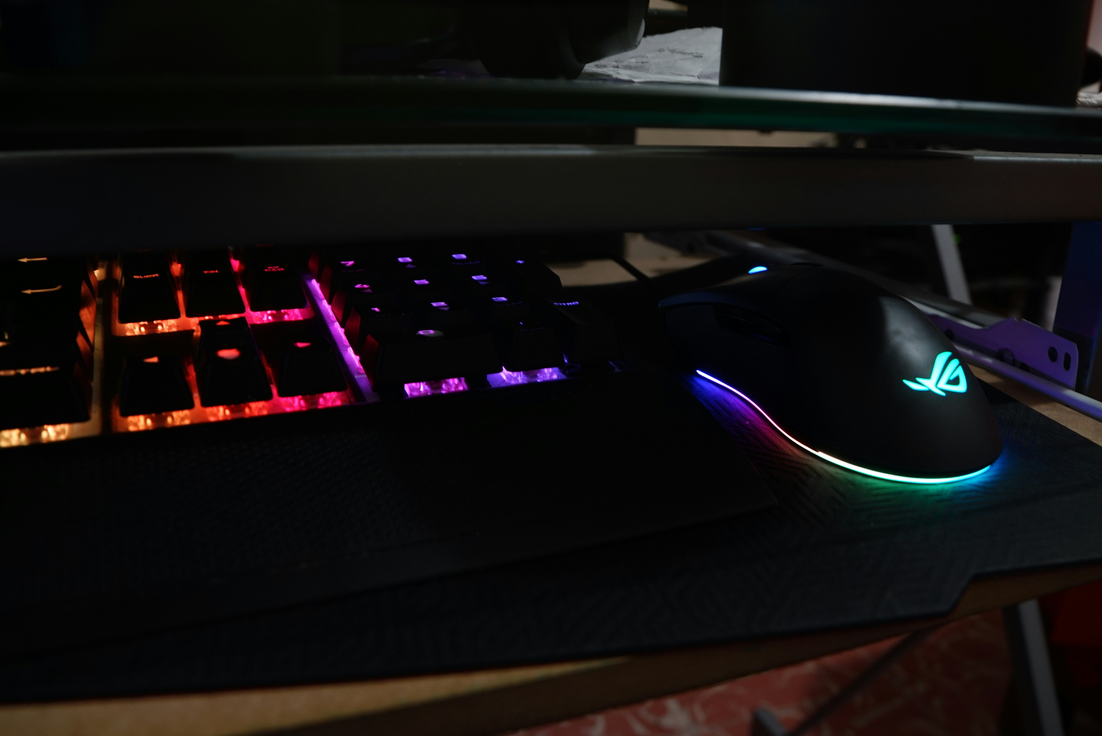 Gaming laptop with RGB keyboard on desk, bright studio lighting