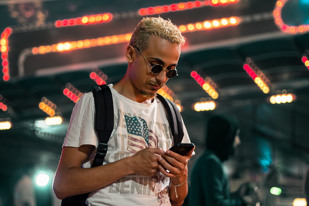 man wearing white crew-neck T-shirt