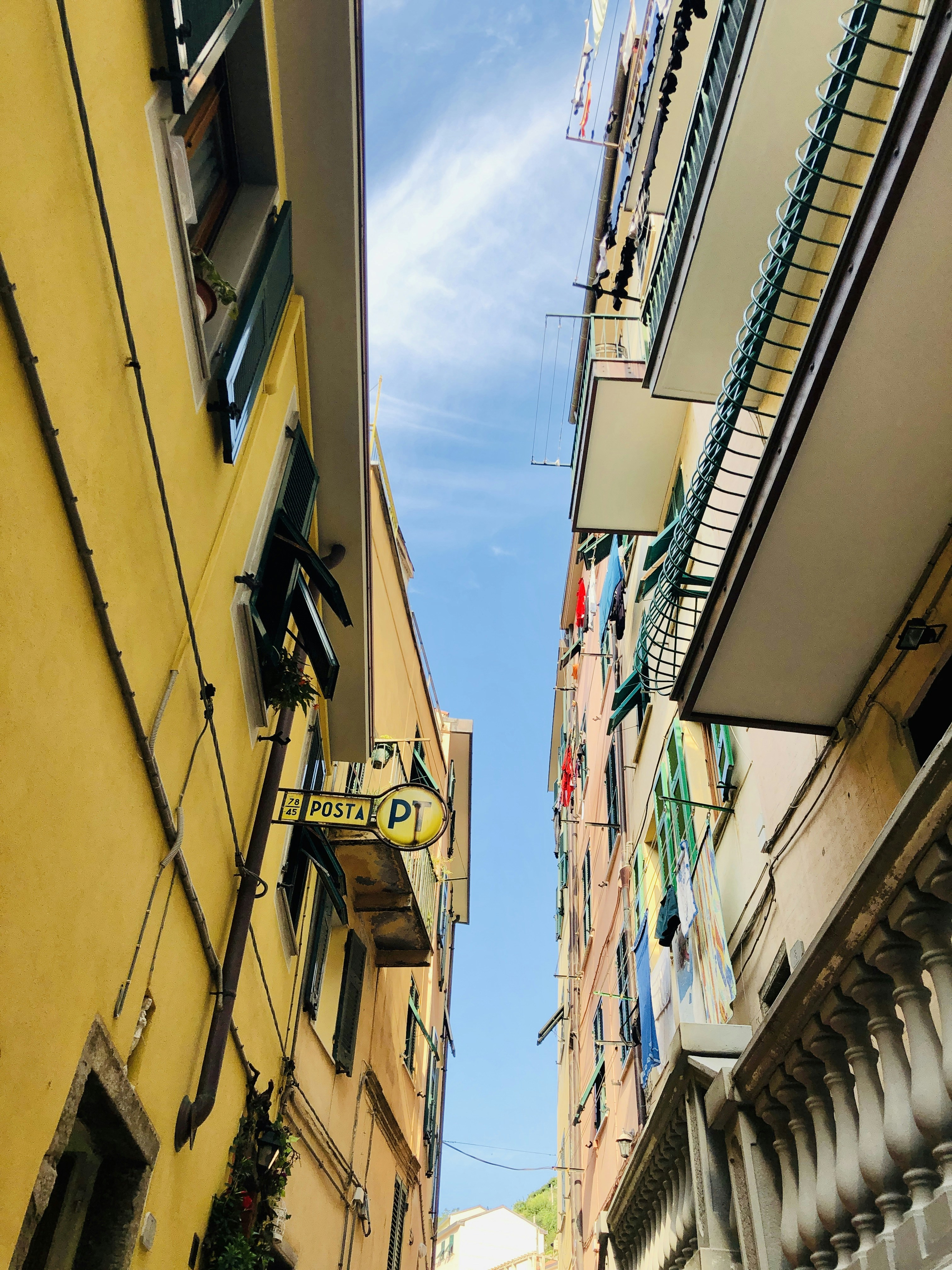 low angle photo of yellow and white wooden houses