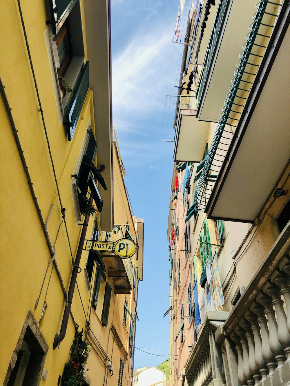 low angle photo of yellow and white wooden houses