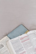 An open book with highlighted text on a desk.