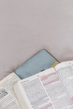 An open book with highlighted text on a desk.