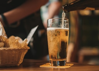 clear drinking glass with beer