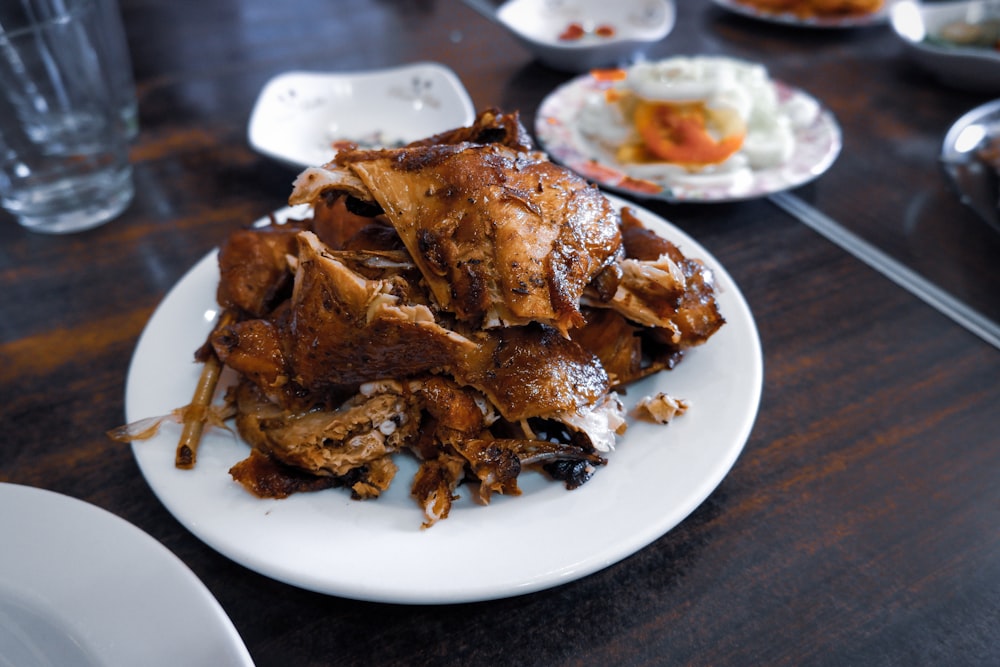 roasted meat on white plate