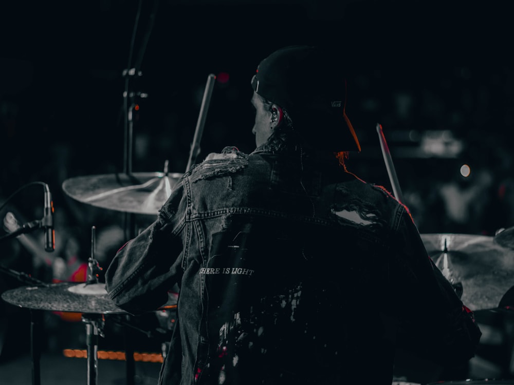 man playing drums photography