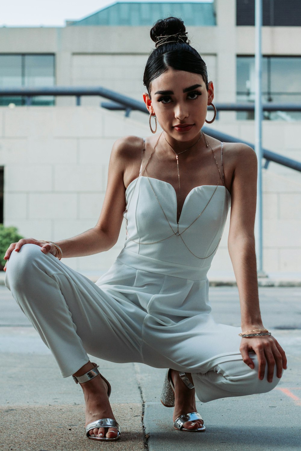 woman wearing white spaghetti strap jumpsuit