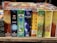 A variety of incense stick boxes are displayed in a row, featuring colorful and diverse designs. Each box has distinct branding and imagery, such as a blue Om design, coconut visuals, and vibrant patterns with gold accents.